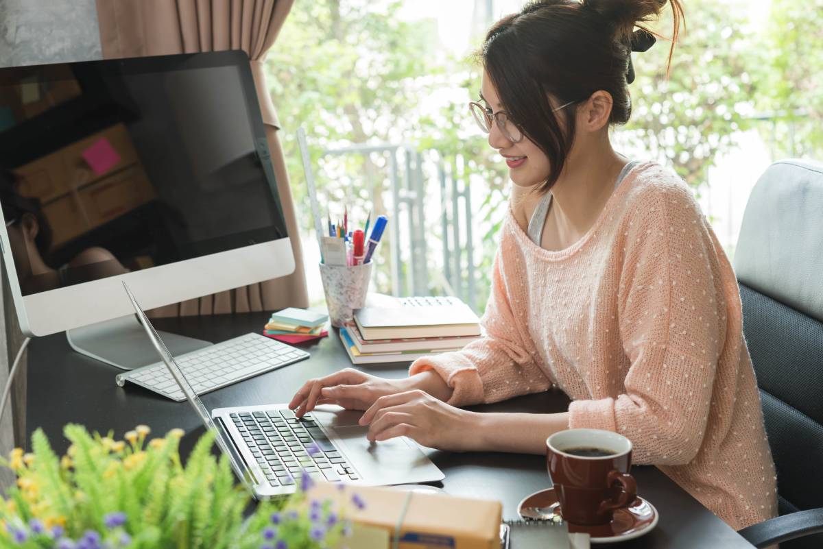 Woman sitting at a desk while working from home